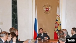 Russian President Dmitri Medvedev (center) presides over meeting on economic issues in the Kremlin on September 18.