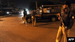 Pakistani police securing the area around a security checkpoint in Karachi in February 2010, when, under still unclear circumstances, senior Taliban commander Mullah Abdul Ghani Baradar was captured. 