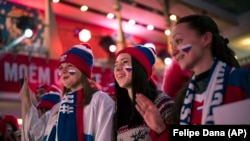 Fans of Russia cheer at the opening of the Sports House, set up to support the Russian delegation of the 2018 Winter Olympics, in Gangneung, South Korea, on February 9.