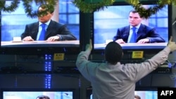 Televisions in a Moscow shop showing an interview with Russian President Dmitry Medvedev in December 2009.