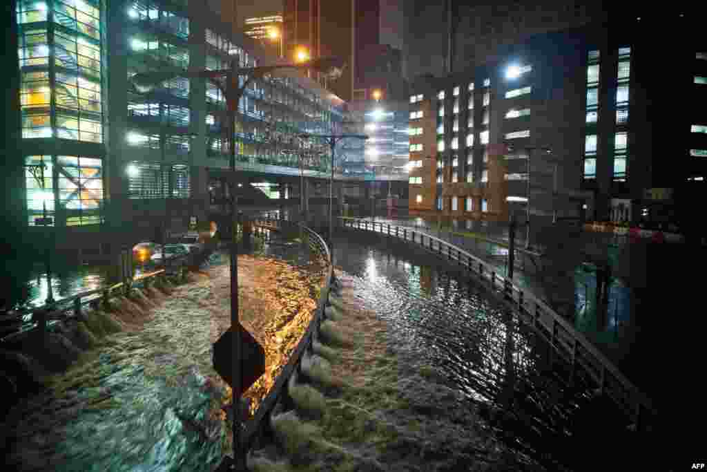 Water rushes into the Carey Tunnel (previously the Brooklyn Battery Tunnel) in the financial district of New York City.