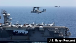 An MV-22 Osprey prepares to land on the flight deck of the USS Abraham Lincoln aircraft carrier in the Arabian Sea on May 17.