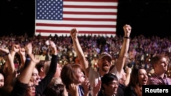 Supporters of President Barack Obama cheer during his election night rally in Chicago on November 6.