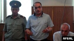 Azerbaijani journalist Eynulla Fatullayev stands trial for possession of drugs in 2010. He was found guilty of the charges, which Amnesty International described as "fabricated," and sentenced to 2 1/2 years imprisonment.