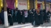 Afghan women stage a protest for their rights at a beauty salon in the Shahr-e Naw area of Kabul on July 19.