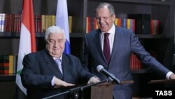 Syrian Foreign Minister Walid Muallem (left) and his Russian counterpart, Sergei Lavrov, give a joint press conference following their talks in Sochi on November 26.