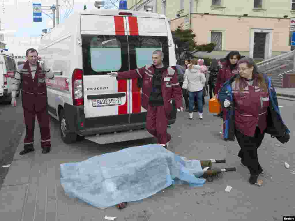 Medics surround the body of a victim.