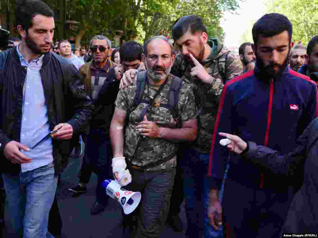 Armenian opposition leader Nikol Pashinian (center) on April 17 in Yerevan:&nbsp;&ldquo;I declare today the launching of a velvet [revolution], a peaceful people&rsquo;s revolution,&quot; Pashinian said. &quot;A revolutionary situation is brewing across the country. Demonstrators are blocking streets and...highways in the cities of Gyumri, Ijevan, Vanadzor, Kapan and Metsamor. People are not going to work. Mass strikes have begun.&quot;