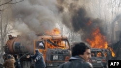 Afghan policemen at the site of a suicide attack in front of German Embassy in Kabul.