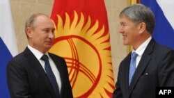 Russian President Vladimir Putin (left) meets with his Kyrgyz counterpart, Almazbek Atambaev, in Bishkek.