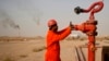 An oil worker at a refinery in Najaf, south of the Iraqi capital, Baghdad