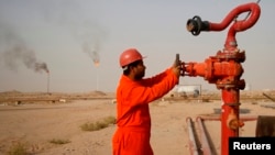 An oil worker at a refinery in Najaf, south of the Iraqi capital, Baghdad