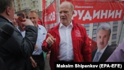 Russian Communist Party leader Gennady Zyuganov (in red) attends campaign event in Moscow on August 26.