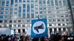 Activists gather before a hearing at the Federal Communications Commission on December 14 in Washington, D.C.