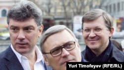 Former Deputy Prime Minister Boris Nemtsov and former Prime Minister Mikhail Kasyanov with ally Vladimir Ryzhkov (left to right) at a rally in Moscow in April