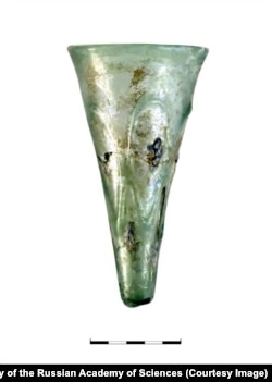 A goblet with decorative drops of blue glass from the Scythian burial site at Front-3.