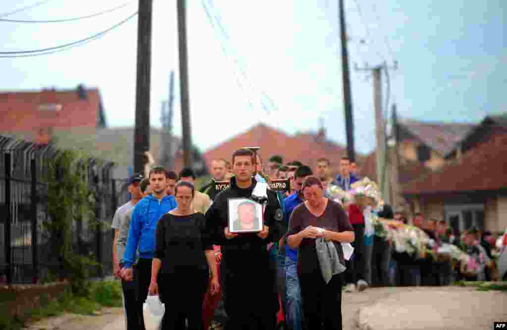 The funeral procession for Zarko Kuzmanovski, one of the slain police officers, in the village of Brvenica near Tetovo