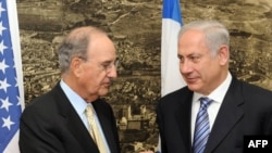 Israeli Prime Minister Binyamin Netanyahu (right, with U.S. Mideast envoy George Mitchell) knows his "political lifeline" depends on U.S. goodwill.