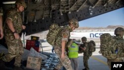 British soldiers disembark after landing in Kabul to assist in evacuating British nationals and entitled persons on August 15.