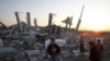 Palestinian boys play where a house once stood in east Gaza City.