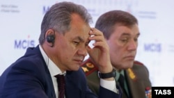 Russian Defense Minister Sergei Shoigu (left) and armed forces Chief of Staff Valery Gerasimov attend a security conference in Moscow in April 2015.