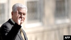 President Vladimir Voronin waves to supporters at a polling station in Chisinau on April 5.