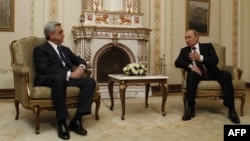 Russian President Vladimir Putin (right) speaks with his Armenian counterpart, Serzh Sarkisian, outside Moscow in March.