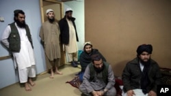 Jailed Taliban militants give an interview in the Pul-e Charkhi prison in Kabul in December 2019.