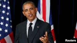 U.S. President Barack Obama speaks during a news conference with the British prime minister at the G7 summit in Brussels.