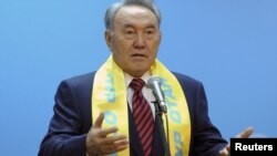 President Nursultan Nazarbaev, wearing the party scarf of Nur Otan, speaks at party headquarters in Astana on January 16.