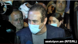 Prosperous Armenia Party leader Gagik Tsarukian speaks to the media after being released on October 22.