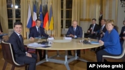 Ukrainian President Volodymyr Zelenskiy (left to right), French President Emannuel Macron, Russian President Vladmir Putin, and German Chancellor Angela Merkel meet in Paris on December 9.