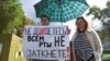 A woman holds a placard reading "You can't shut up everyone!" as journalists and supporters take part in a protest against censorship in Moscow in September.