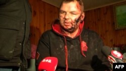 A TV grab made on January 31 and taken from a same-day broadcast by Ukrainian Channel 5 television shows Ukrainian opposition activist Dmytro Bulatov being interviewed in Kyiv. 