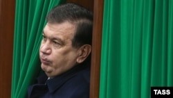 Then-acting Uzbek President Shavkat Mirziyoev leaves a voting booth after casting his ballot in Tashkent in December 2016.