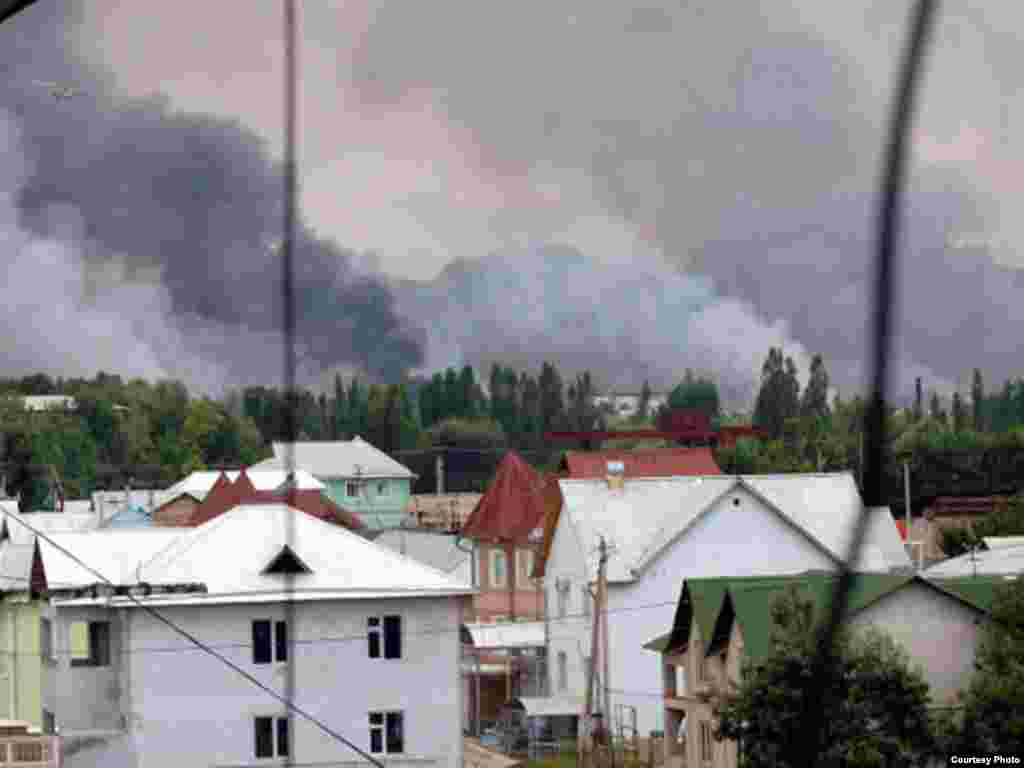 Plumes of smoke rise from burning buildings in Osh, southern Kyrgyzstan.