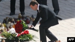 Russian President Dmitry Medvedev laid flowers at a shrine in Krakow, Poland, where a funeral mass was held April 18 for the late Polish President Lech Kaczynski and his wife, Maria.