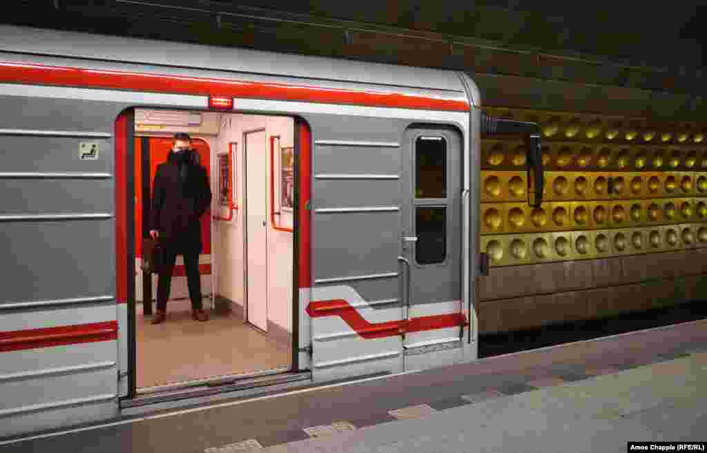 A man in a nearly empty subway car on March 17 in a station near Prague&#39;s tourist center.&nbsp;