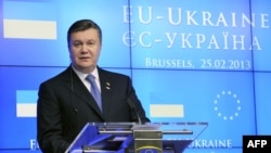 Ukrainian President Viktor Yanukovych is under pressure from Brussels and Moscow, and the camps within Ukraine pulling each way.