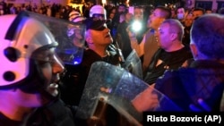 Montenegrin police block the street during a protest in Niksic on May 13.