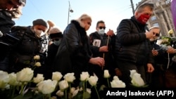 People gather in Belgrade to remember the medical staff who have lost their lives to COVID-19.