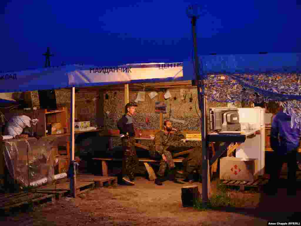 Blockaders watching television. The activists tap into electrical mains running past their camp but claim to pay for the power they use. &nbsp; 