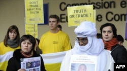 Uzbek human rights defender Nadejda Ataeva (left) and other activists rally in favor of detained Uzbek human rights defenders in front of the European Commission building in Brussels today.