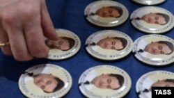 Pins bearing portraits of Sergei Magnitsky, for which the Magnitsky Act was named. 