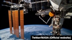 NASA woke the sleeping, seven-member crew of the International Space Station and sent them scrambling for refuge in a docked spacecraft.