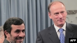 Iran President Mahmud Ahmadinejad (left) with Russian National Security Council secretary Nikolai Patrushev during a meeting in Tehran on August 16