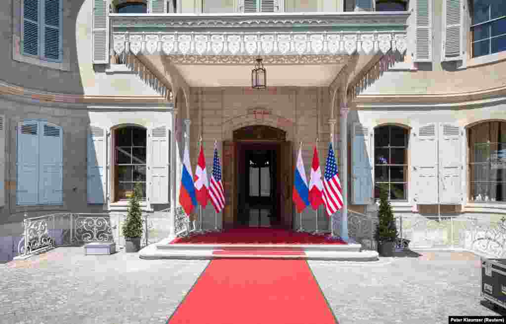 U.S., Russian, and Swiss flags at the entrance to Villa La Grange, on the banks of Lake Geneva.&nbsp;