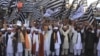 Supporters of pro-Taliban Pakistani religious Jamiat Ulema-e Islam Nazryate party rally to celebrate the signing agreement between United States and Taliban in Quetta Balochistan in March 2020. 