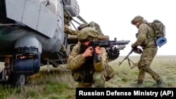 Russian troops take part in drills in Crimea, which Moscow forcibly seized from Ukraine in 2014. 