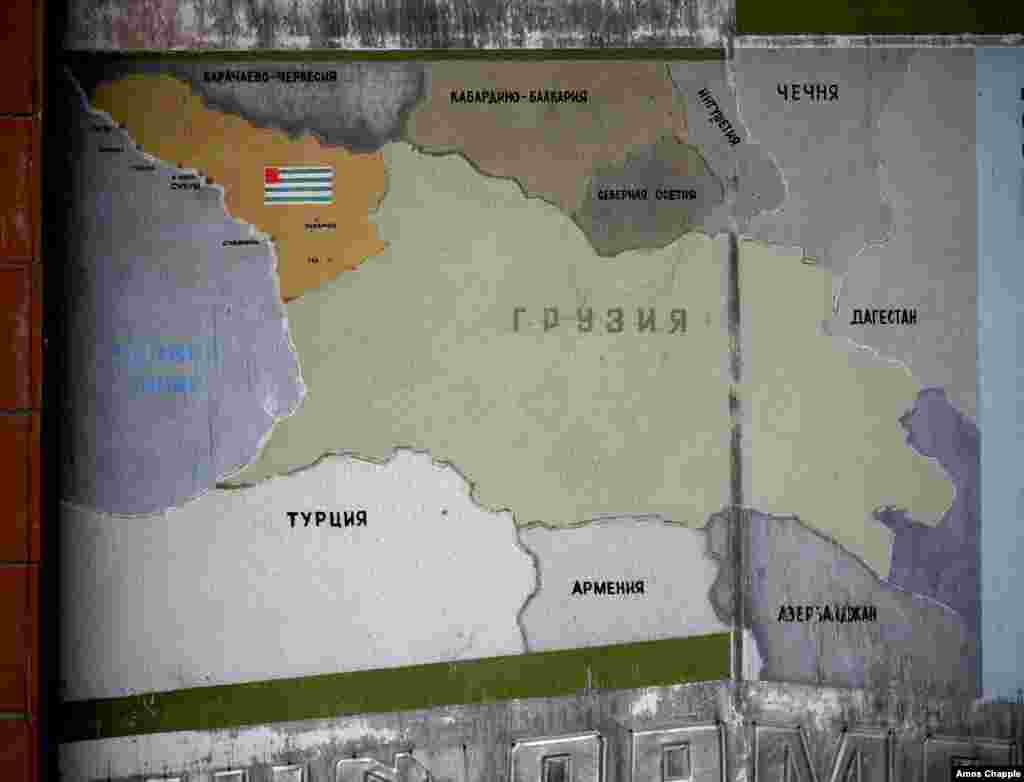 An old sign shows the territory of Abkhazia at top left, with the rest of Georgia in the center.